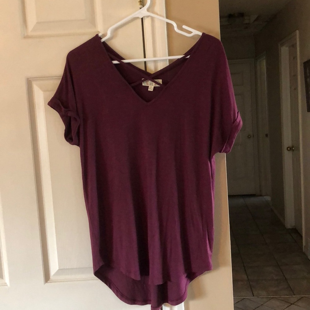 Loose fit burgundy top with crisscross detail